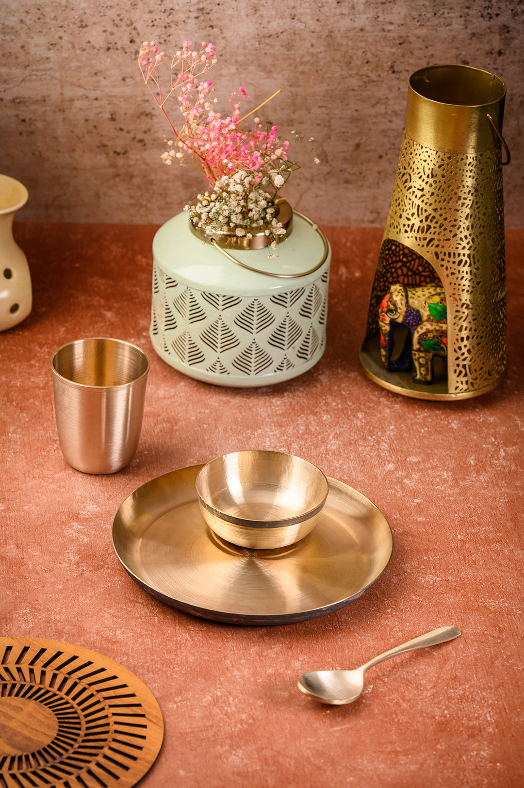 Kansa Baby Dinner Set / Baby Gift Set displayed with bronze plate, bowl, glass, and decorative elements.