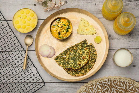 Kansa utensils laid on a dining table — health benefits of Kansa