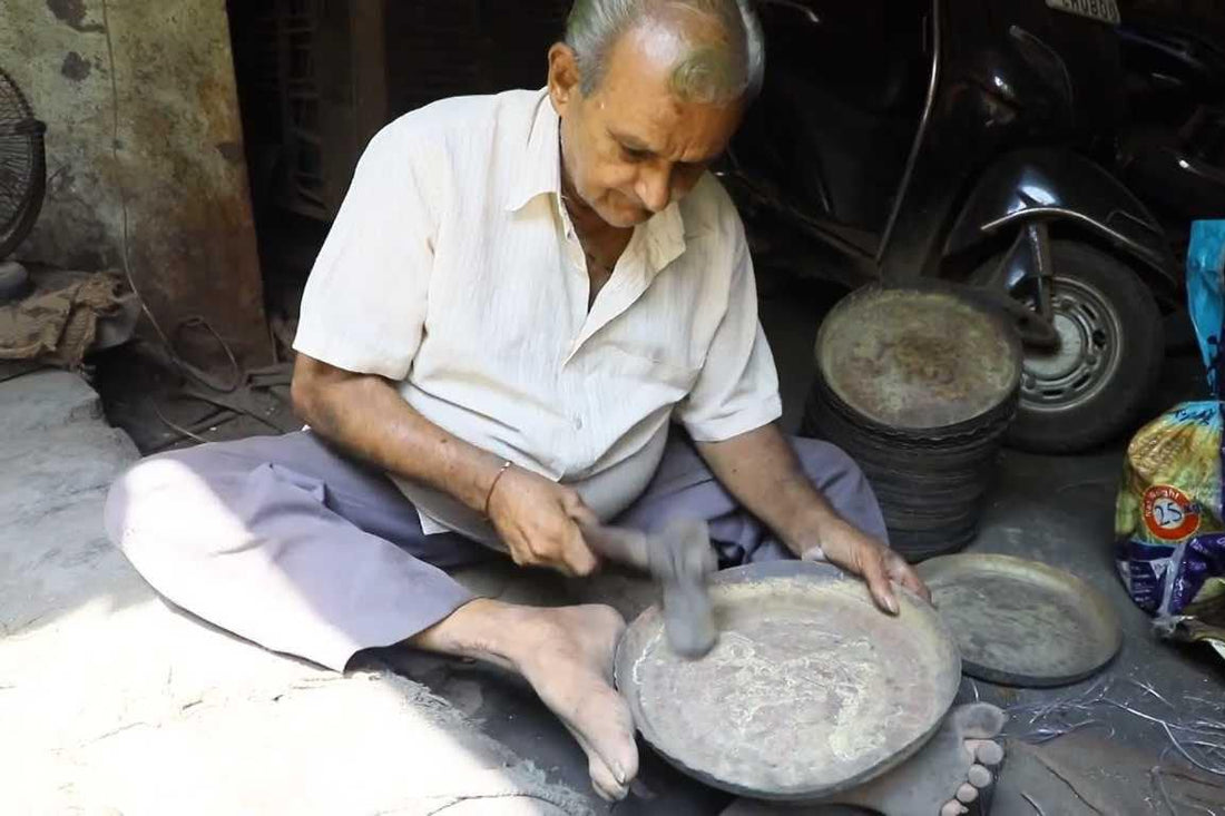 Artisan handcrafting pure Kansa utensils at Kansawala in Sihor